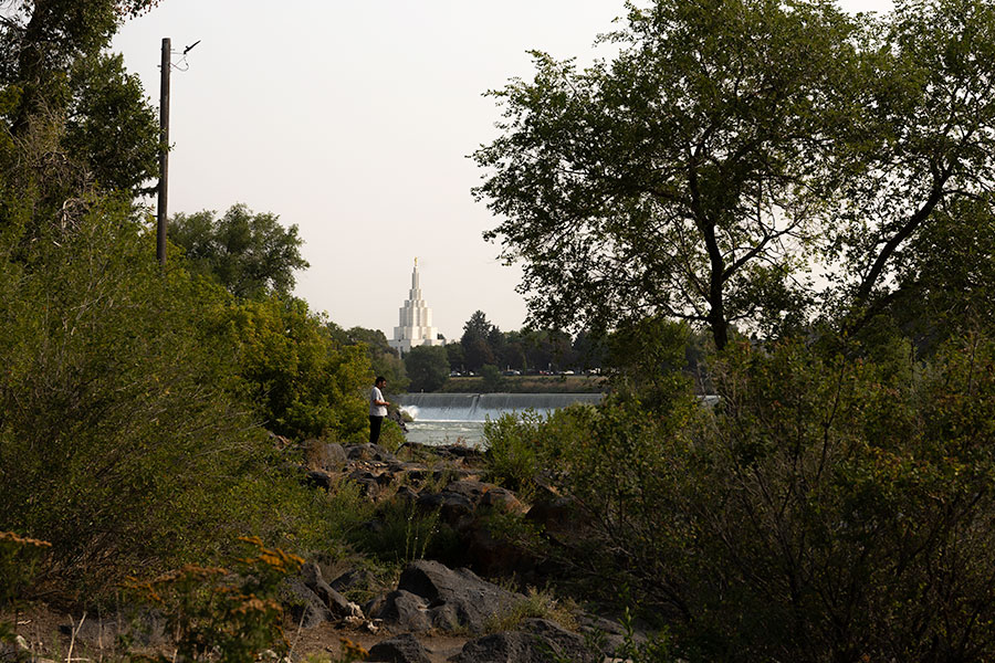 Smokey skies are seen over the Idaho Falls Temple and Snake River, on Thursday, Aug. 6, 2026, in Idaho Falls. Several counties in East Idaho are under an air quality advisory due to wildfire smoke.