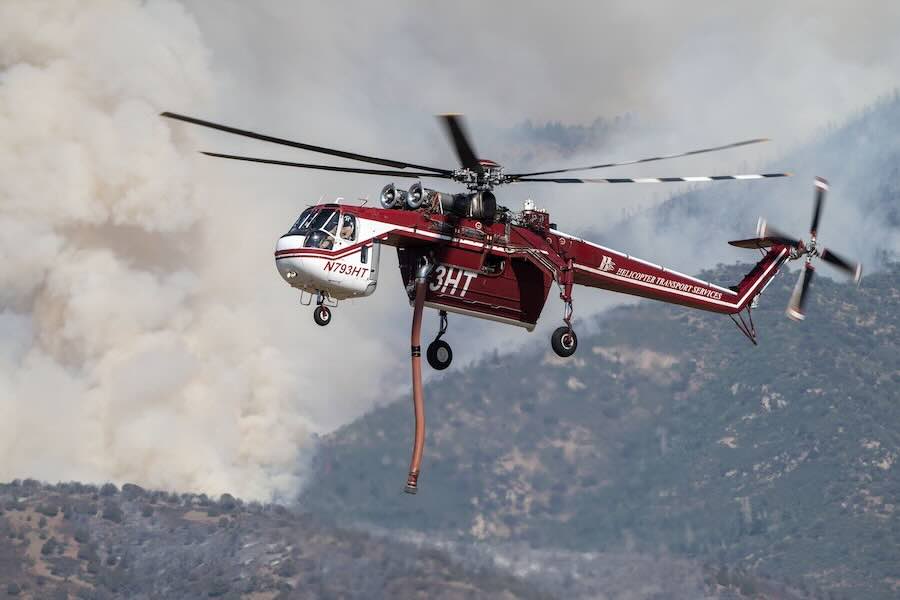 A Sikorsky Skycrane approaches to refill as crews fight the Widemouth 2 Fire east of Fillmore, Utah, on Tuesday, Aug. 4, 2026.