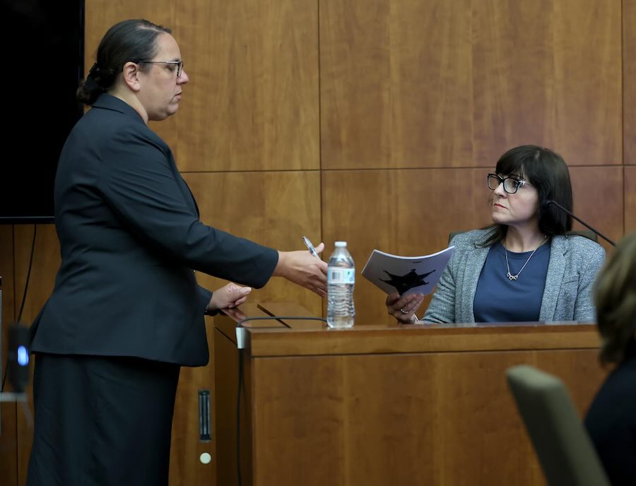 Prosecutor Shanan Buckingham, left, shares evidence with Nichole Bradley, right, a deputy superintendent with the Plymouth County Sheriff’s Office, during Lindsay Clancy's murder trial at Plymouth Superior Court, Wednesday, Aug. 12, 2026, in Plymouth, Mass.