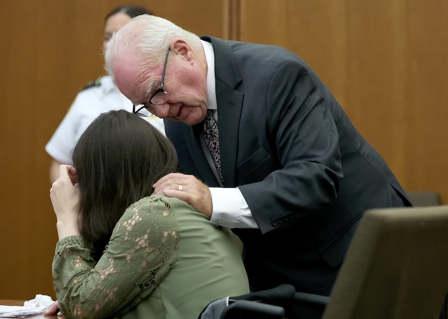 Defense attorney Kevin Reddington consoles his client, Lindsay Clancy, who is sobbing, during Clancy's murder trial at Plymouth Superior Court, Wednesday, Aug. 12, 2026, in Plymouth, Mass.