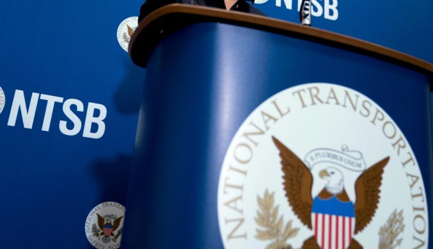 The National Transportation Safety Board logo and signage are seen at a news conference at NTSB headquarters in Washington, Dec. 18, 2017. | Andrew Harnik, Associated Press