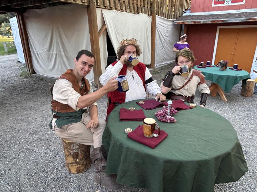 The king and members of his court share a drink at Thornshire Renaissance Faire King's Feast. Emily Miller