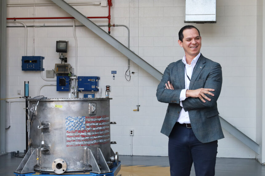Deployable Energy's CEO Bobby Gallagher, next to the Unity Nuclear Battery | Kaitlyn Hart, EastIdahoNews.com