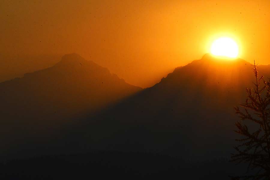 The sun peeking over a peak at Glacier NP on our last day as we left "A Little Piece of Heaven." | Bill Schiess, EastIdahoNews.com