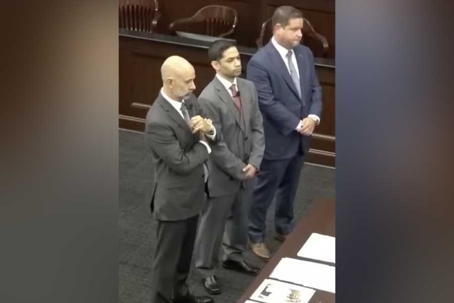 Mario Fernandez Saldana, center, is flanked by his attorneys, James Hill and Jesse Dreicer, as he waives his right to testify in his murder trial at Duval County Courthouse, Tuesday, Aug. 25, 2026, in Jacksonville, Florida.