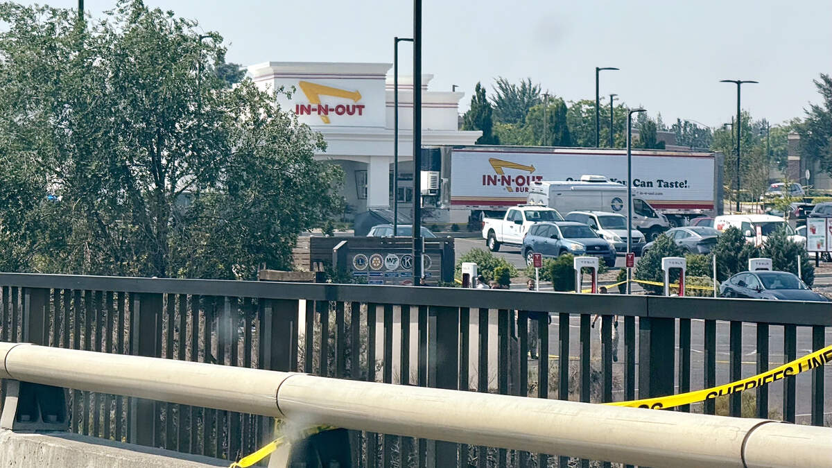 Police lines surround the area Sunday around In-N-Out Burger where a gunman killed at least three people on Saturday, Aug. 1 in Twin Falls, Idaho. | Mark Dee, Idaho Statesman