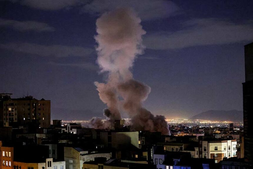 A smoke plume rises following a missile strike on a building in Tehran on March 1. Mandatory Credit: Atta Kenare/AFP/Getty Images via CNN Newsource