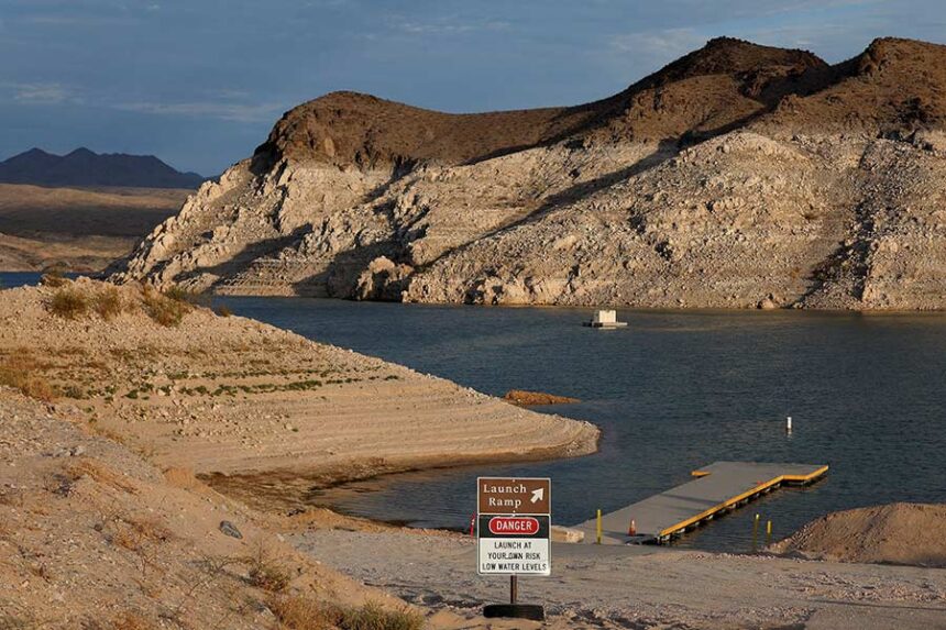 The recently extended Echo Bay launch ramp accommodates lower water levels at Lake Mead near Overton, Nevada, on July 21. Previous water levels are visible as "bathtub rings" on nearby cliffs. Mandatory Credit: Caroline Brehman/Reuters via CNN Newsource