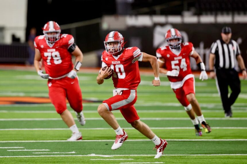 Madison quarterback Micah Dougherty looks for running room in Thursday's win over Riverton. | Kyle Riley, EastIdahoSports.com.