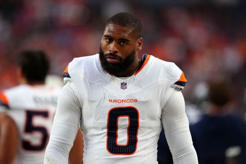 Denver Broncos linebacker Jonathon Cooper walks on the sideline during the first half of a preseason NFL football game against the Minnesota Vikings, Friday, Aug. 28, 2026, in Denver. (AP Photo/Jack Dempsey)