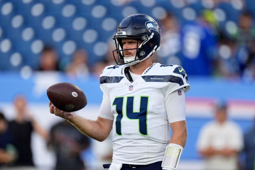 Seattle Seahawks quarterback Sam Darnold warms up before a preseason NFL football game against the Tennessee Titans, Sunday, Aug. 23, 2026, in Nashville, Tenn. (AP Photo/George Walker IV)