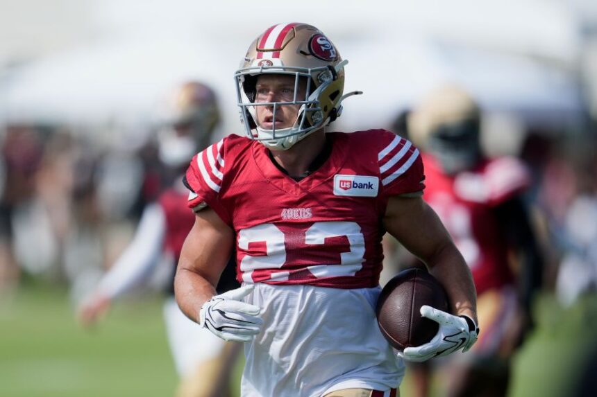 San Francisco 49ers running back Christian McCaffrey (23) runs during the NFL football team's training camp, Thursday, Aug. 6, 2026, in Santa Clara, Calif. (AP Photo/Jeff Chiu)