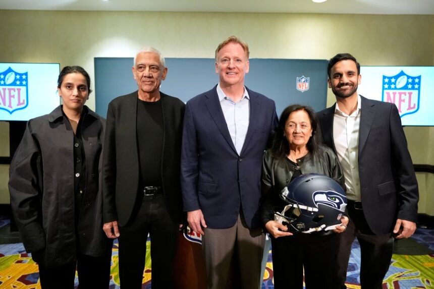 Seattle Seahawks owner's The Khosla family, and NFL commissioner Roger Goodell, Nina Khosla, left, Vinod Khosla, Neeru Khosla, and Neal Khosla pose for a portrait during a news conference at an NFL football owners meeting on Wednesday, Aug. 26, 2026, in Atlanta. (AP Photo/Brynn Anderson)