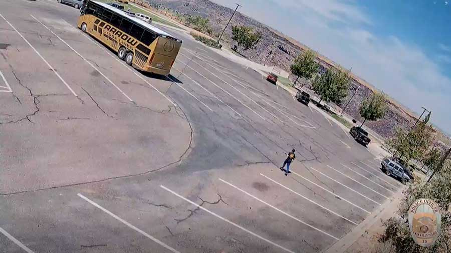 Surveillance video shows an armed man walking through a parking lot near the Twin Falls In-N-Out Burger's where he had just shot several people on Saturday, Aug. 1, 2026.