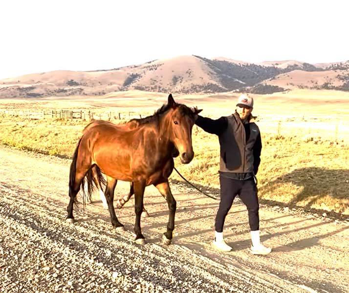 Riley Mickelsen walking his horse, Dasher. | Courtesy Ashtyn Mickelsen