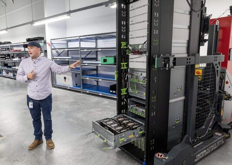 Scott Stillings, a critical operations manager at Meta's Kuna Data Center, describes the rack of servers being held on a robotic transport while directing a tour Thursday. | Darin Oswald, Idaho Statesman