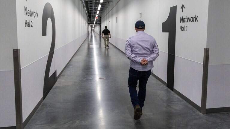 Scott Stillings, a critical operations manager at Meta's Kuna Data Center, leads a tour of the large buildings housing data rooms. The $1.2 billion project officially began operations Thursday. | Darin Oswald, Idaho Statesman