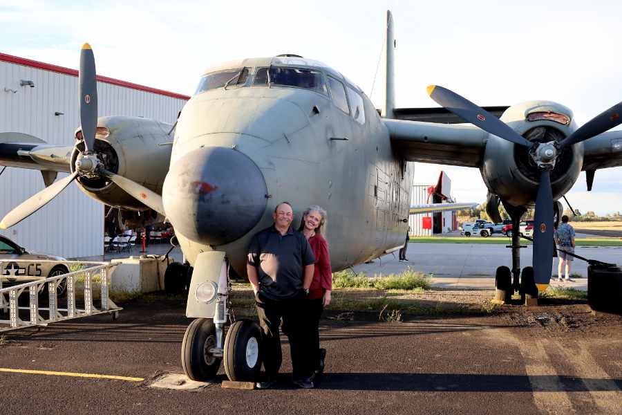 Corey and Erica Radford standing in front of the world's oldest Cariobou at the Legacy Flight Museum | Rachel Jensen, EastIdahoNews.com