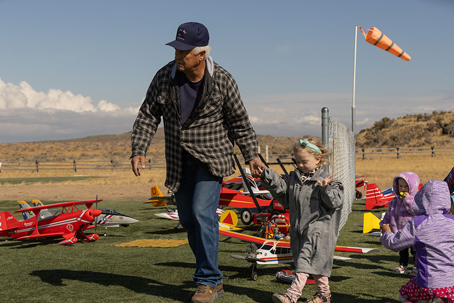 Member of the Desert Eagles Ty Tomchak escorting Emma Jones to start flying at Saturday's celebration. | Daniel V. Ramirez, EastIdahoNews.com