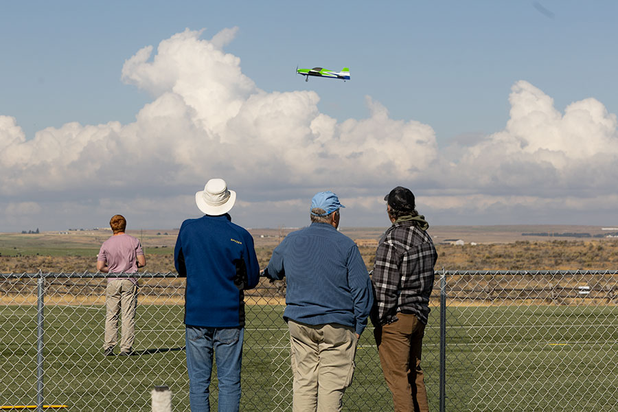 Community members watching a member of the Desert Eagles Club fly their RC plane during Saturday's event. | Daniel V. Ramirez, EastIdahoNews.com
