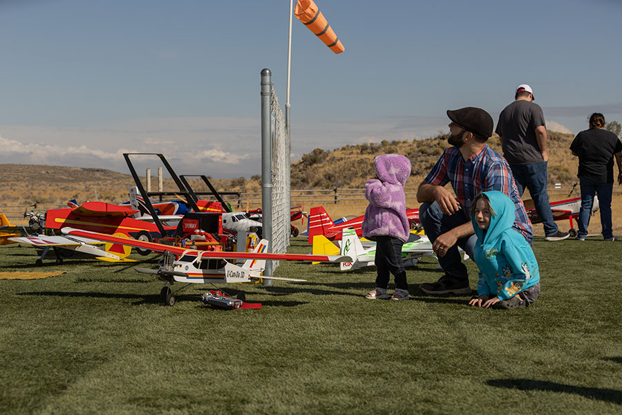 Over 100 community members made their way out to the Desert Eagles Club's new flying field, like Zack Kones and his two daughters, Heidi and Elsie Jones. | Daniel V. Ramirez, EastIdahoNews.com