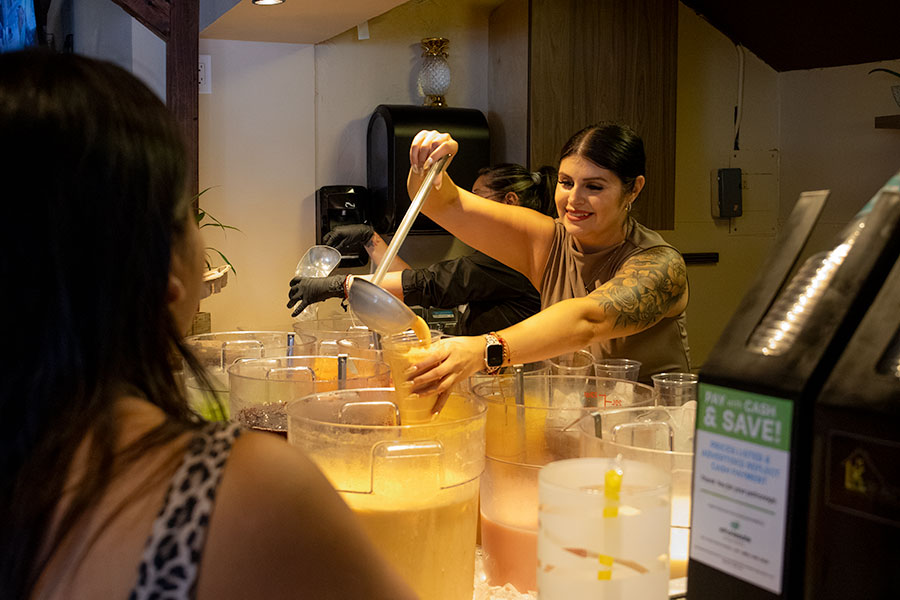 Co-owner of El Cantaro and Owner of Aguas Maria's, Maria Sanchez serving customers her renowned aquas frescas during the grand opening of El Cantaro. | Daniel V. Ramirez, EastIdahoNews.com