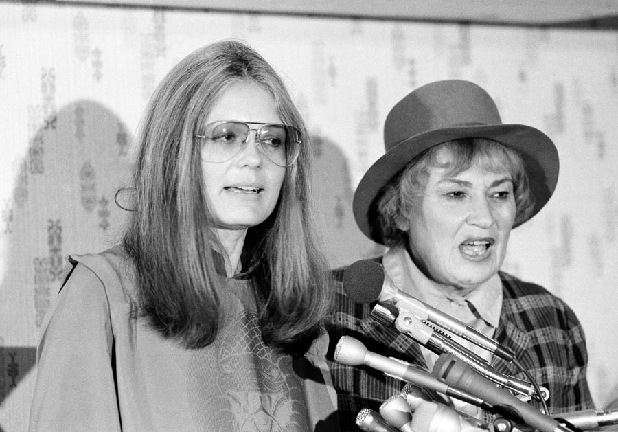 Gloria Steinem, secretary of Women USA, left, and former Congresswoman Bella Abzug, president of Women USA, answer questions at a press conference in Washington, Nov. 20, 1979. (AP Photo/Harvey Georges, File)