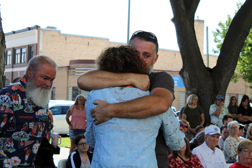Hevenlee Hoopes, the mother of Amber Hoopes, being embraced by loved ones after she spoke at the Missing Persons Day event. | Kaitlyn Hart, EastIdahoNews.com