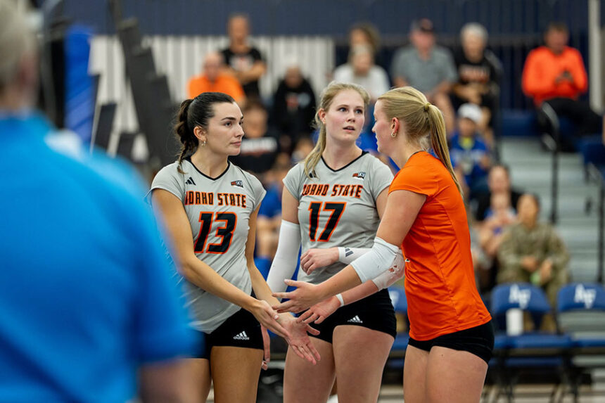 ISU libero Aspen Boice (orange jersey) interacts with Ava Brickner (13) and Annelie Wilson (17) during the Amy Svoboda Memorial Classic