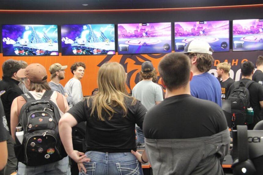 ISU Esports Arena people looking at TVs