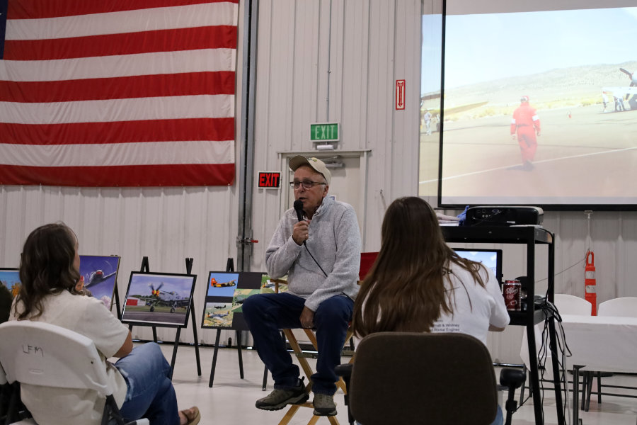 John Bagley presenting a slideshow during the award ceremony at the Legacy Flight Museum | Rachel Jensen, EastIdahoNews.com