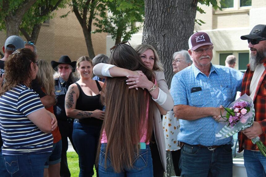 Lentz embracing loved ones after speaking about her story of surviving a kidnapping. | Kaitlyn Hart, EastIdahoNews.com