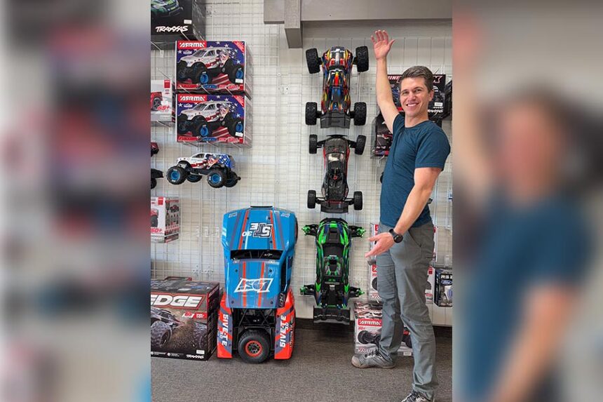 Bryce Shurtliff standing next to just some of his inventory and OCDRC.
