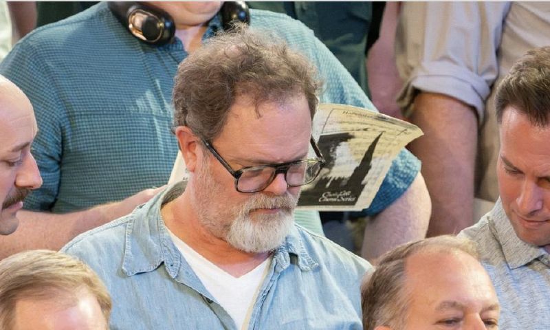 Rainn Wilson looks at choir music during a rehearsal for the Tabernacle Choir last week. He interacted with the choir while working on a documentary about what God means in the modern world. - The Tabernacle Choir, Instagram