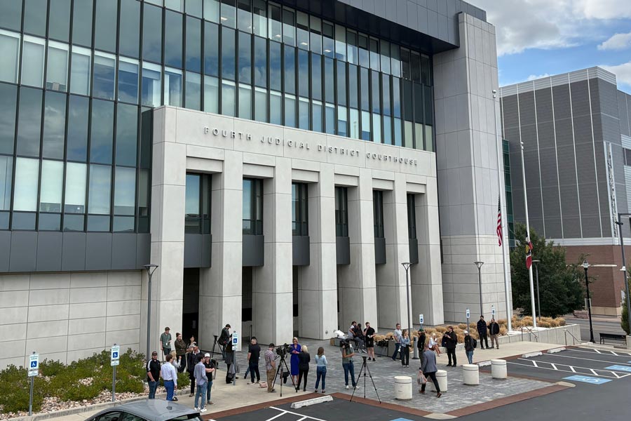 In this photo taken with a smartphone, people gather outside the Fourth Judicial District Courthouse in Provo, Utah, before a key hearing for Tyler Robinson, who is accused in the fatal shooting of Charlie Kirk, Tuesday, Sept. 1, 2026. | Hannah Schoenbaum, Associated Press