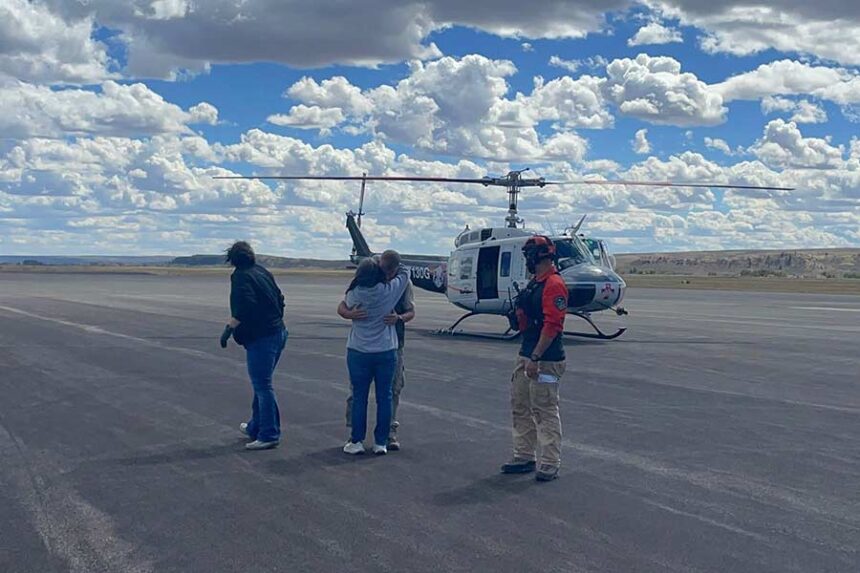 Jonathan Bailey is greeted with a hug at airport in Pinedale on Friday after being rescued after wandering for a week in the Wind River Range. | Courtesy Sublette County Sheriff's Office