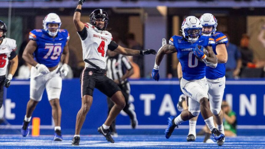 Boise State running back Dylan Riley breaks away from the South Dakota defense on his way to an 83-yard touchdown run in the fourth quarter Saturday at Albertsons Stadium. Darin Oswald doswald@idahostatesman.com