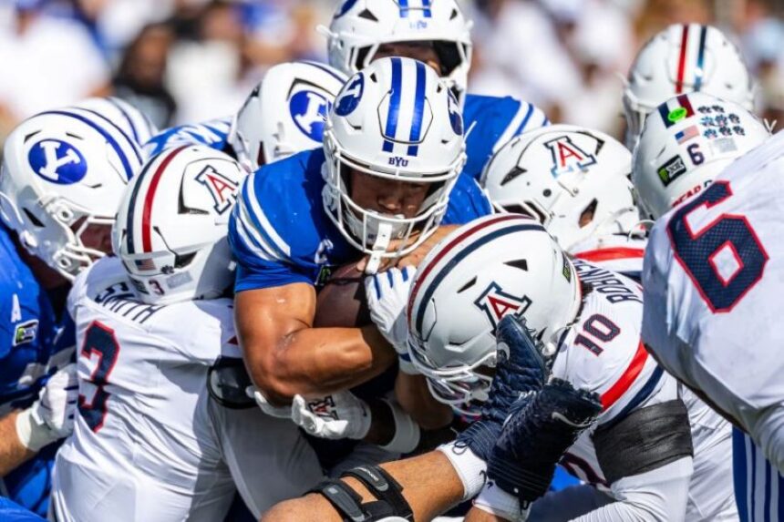 BYU running back LJ Martin pushes the pile forward during Saturday’s game against Arizona. | Lukas Katilius, Deseret News via KSL.com.