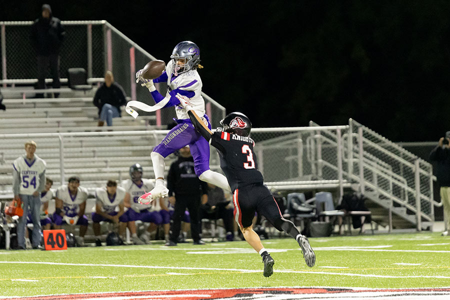 Century Justus Mangum goes high for the catch against Hillcrest