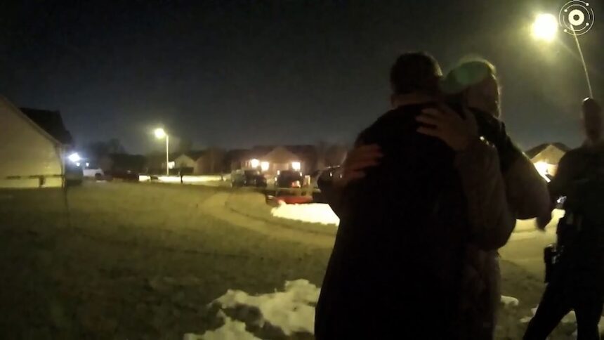 Caleb Flynn embraces his mother-in-law as law enforcement investigates the killing of his wife in February 2026.