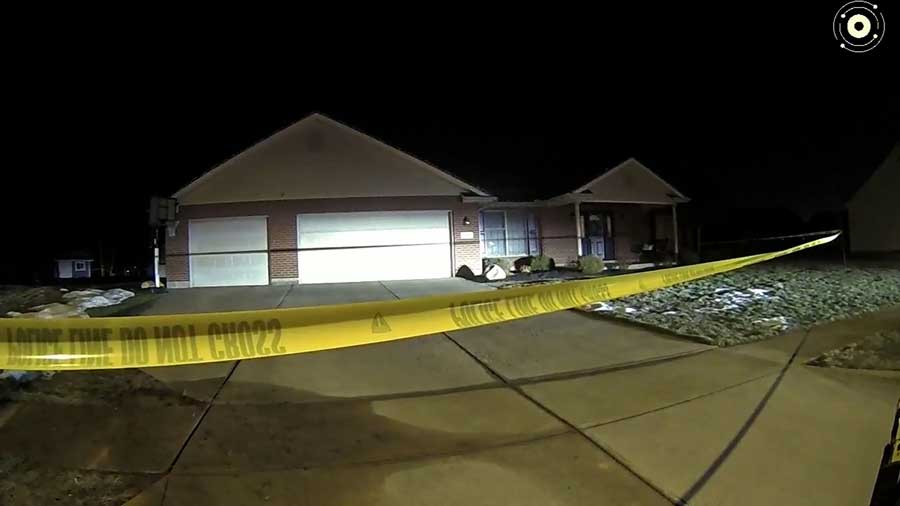 The Flynn home is seen in a still image taken from police body camera footage as officers arrive to investigate the killing of Caleb Flynn's wife, Ashley, on Feb. 16, 2026.