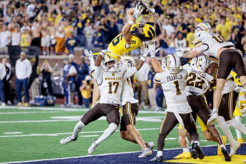 Michigan's wide receiver JJ Buchanan (6) makes the game-winning catch to win over Western Michigan with a last-second touchdown during an NCAA college football game in Ann Arbor, Mich., Saturday, Sept. 5 2026. (Jacob Hamilton/Ann Arbor News via AP)