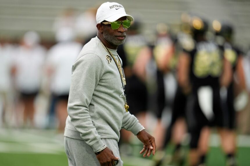 Colorado head coach Deion Sanders walks on the field before an NCAA college football game between Georgia Tech and Colorado, Thursday, Sept. 3, 2026, in Atlanta. (AP Photo/Mike Stewart)