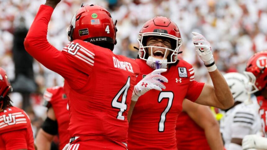 AMES, IA - SEPTEMBER 26: Wide receiver Braden Pegan #7 of the Utah Utes celebrates with teammate quarterback Devon Dampier #4 of the Utah Utes after scoring a touchdown in the first half of play against the Iowa State Cyclones at Jack Trice Stadium on September 26, 2026, in Ames, Iowa. (Photo by David Purdy Photography)