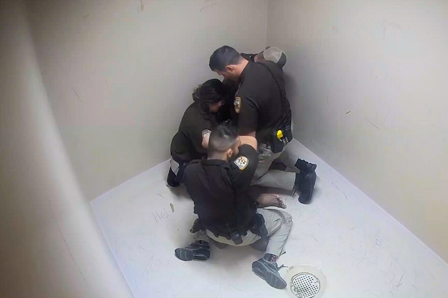 officers restrain Durrah