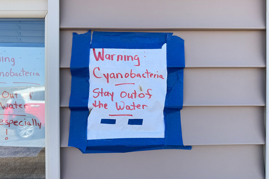 A sign posted at Blacktail/Ririe Reservoir, alerting the public about cyanobacteria in the water. | Kaitlyn Hart, EastIdahoNews.com