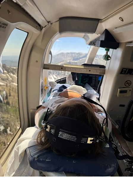 Chloe Hanish being life flighted after nearly severing her hand. | Courtesy of Chase Hanish