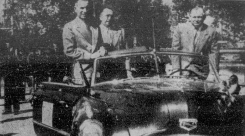Mayors of three leading southern Idaho towns rode in the 30-block-long parade which opened the five-day Eastern Idaho State Fair at Blackfoot Tuesday. Shown, left to right, are Mayors W.W. Halsey, of Pocatello, Thomas L. Sutton, of Idaho Falls, and Merrill Boyle, of Blackfoot. The Pocatello High School band, one of eight to march in the parade, is shown behind the mayor's car. More than 10,000 people lined the Blackfoot business district streets to watch the colorful western event. Caption dated Sept. 14, 1949.