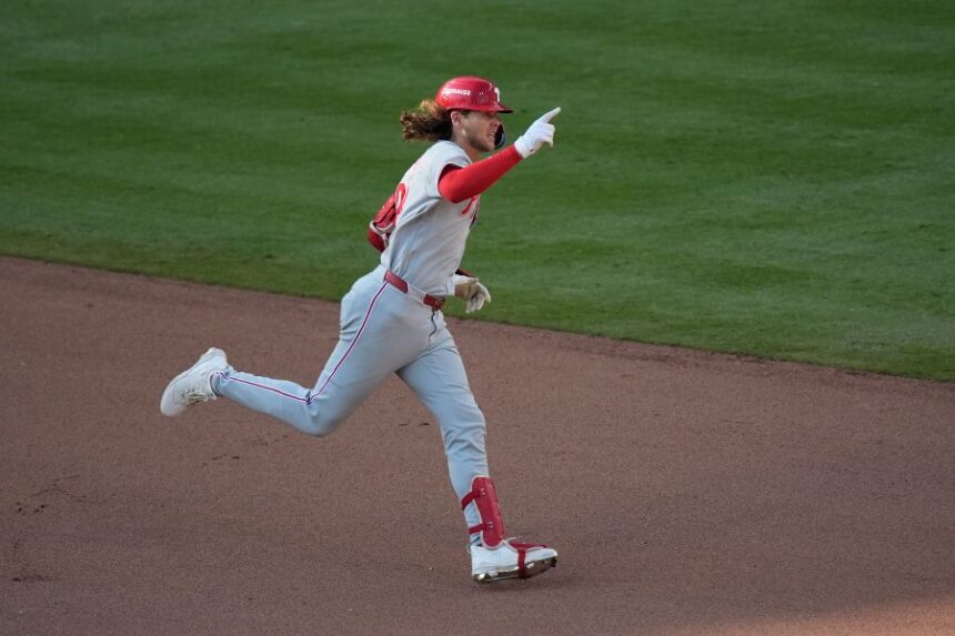 Philadelphia Phillies' Alec Bohm celebrates his home run against the Atlanta Braves in the 10th inning during Game 2 of baseball's National League Wild Card Series Wednesday, Sept. 30, 2026, in Atlanta. (AP Photo/Mike Stewart)