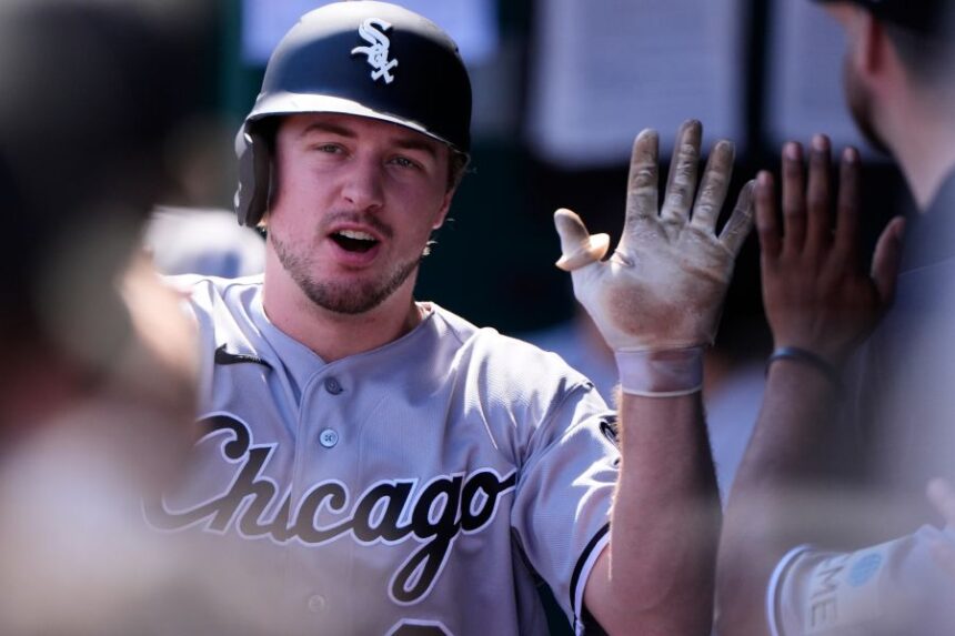 Chicago White Sox's Kyle Teel celebrates in the dugout after scoring on a sacrifice fly hit by Andrew Benintendi during the first inning of a baseball game against the Kansas City Royals, Thursday, Sept. 24, 2026, in Kansas City, Mo. (AP Photo/Charlie Riedel)